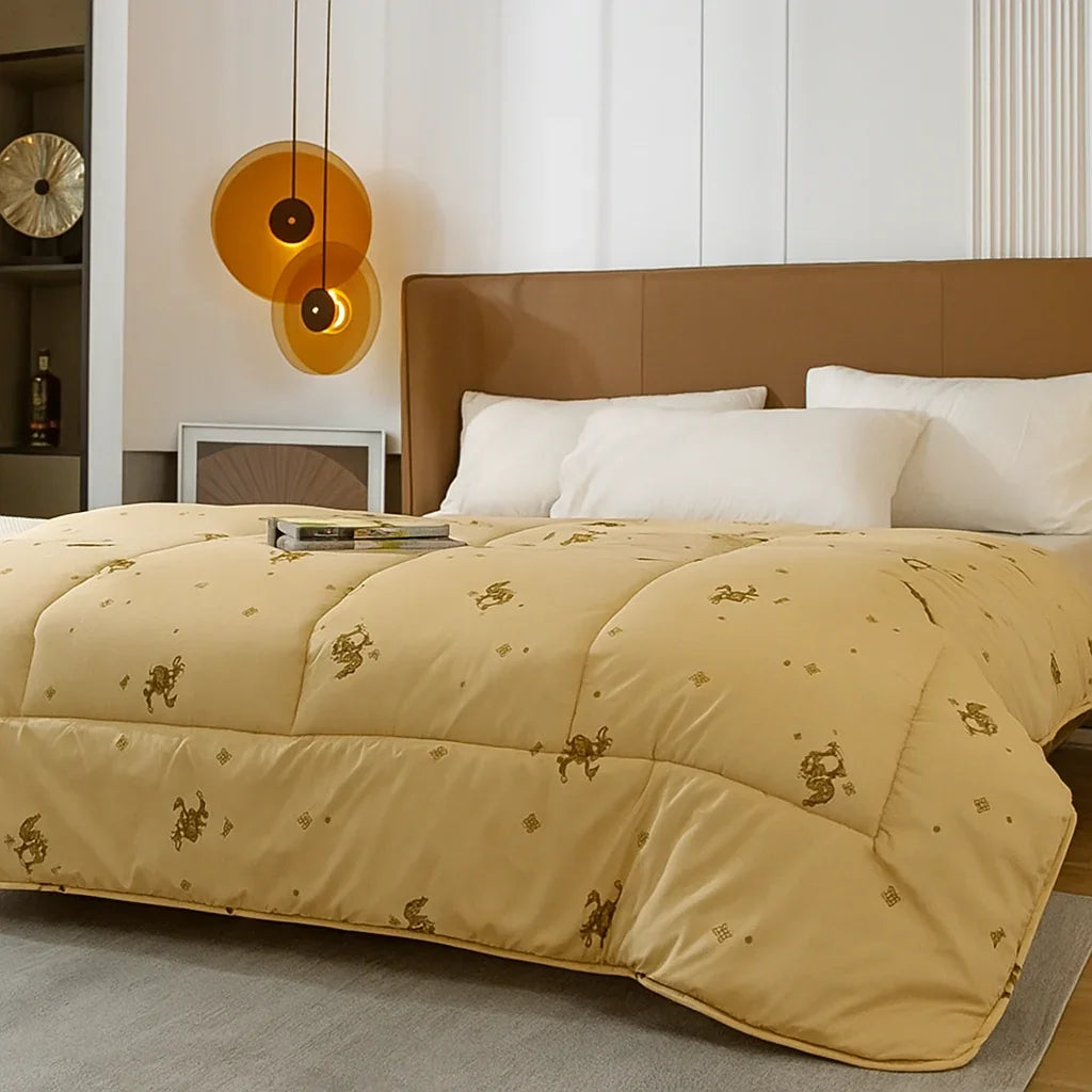 Moja Devica 100% wool comforter on a modern bed with white pillows and warm lighting