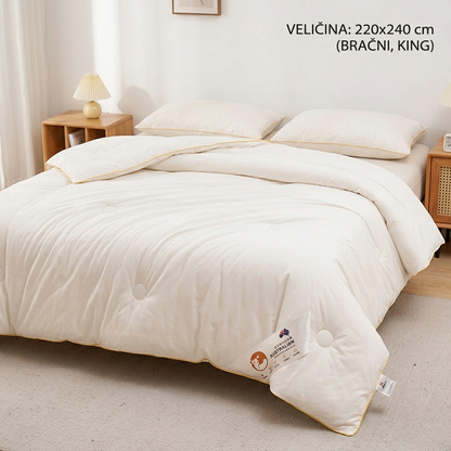 Ekstra veliki King Size poplun od merino vune raskošno prostrt preko velikog bračnog kreveta